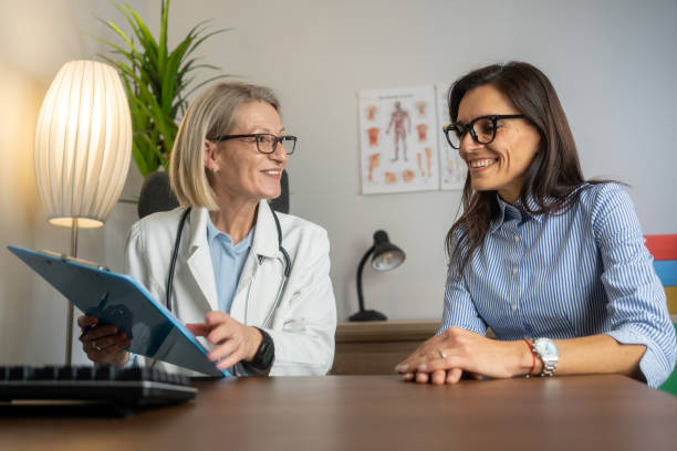 Doctor and patient reviewing health data together